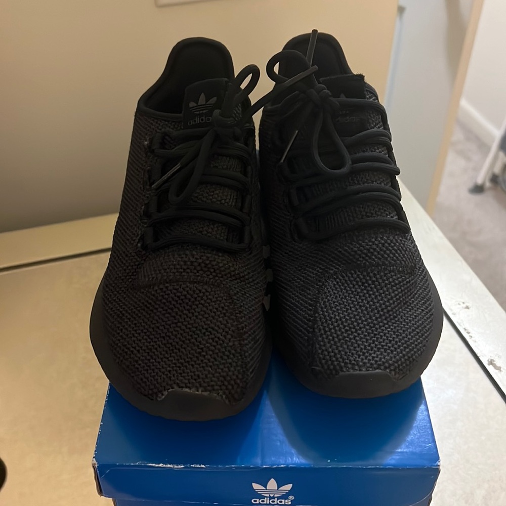 Adidas black sneakers. Kids size 3 1/2. In good condition.